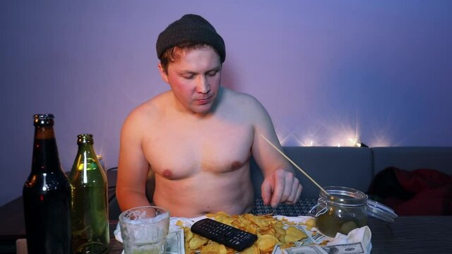 Churl man throws the chips and tries to catch them with his mouth