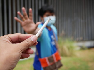 asian man say NO cigarette,No smoking concept.
