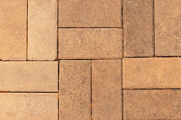 Obraz premium Brown cement block tiles outside the building pattern and seamless background