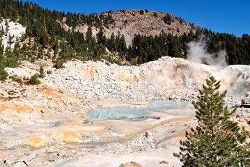 Fototapeta na wymiar Bumpass Hell is the largest hydrothermal or geothermal area in Lassen Volcanic National Park in California with hot springs, fumaroles, and boiling mudpots. A boardwalk keeps visitors safe. 