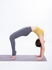 Young women practice yoga