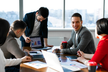 Fototapeta premium Team people discussing about work in an office of colleagues working together on a project.