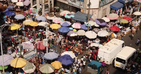 Makola crowded street market overhead Ghana Africa. Historical busy congested market downtown, Accra, Ghana. Historic place to buy and sell products low income poverty of Africa. Thousands of people.