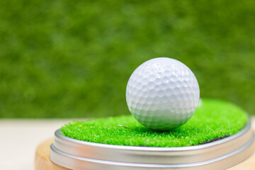 Golf ball is on green grass