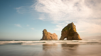 Archway Island on Wharariki beach at sunrise, South Island, New Zealand