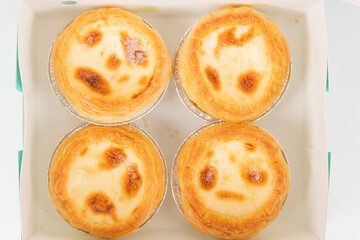 Baked egg tart on white background