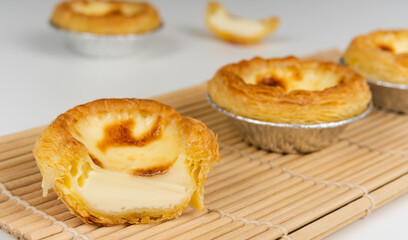Baked egg tart on white background