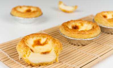 Baked egg tart on white background