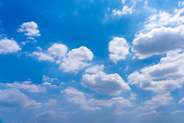 Naklejka na ściany i meble Beautiful sky background with white clouds floating