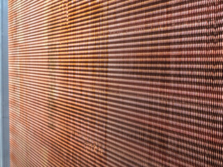 Copper fins of a condensing coil of an air conditioning unit offshore application.