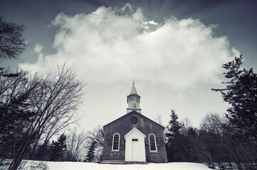 Landscapes of south eastern Ontario featuring waterfalls and snowy landscapes from the cold bitter winter in hinterland.  Rural scenics with church and buildings.