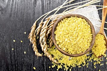 Bulgur in bowl on board top