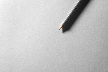 Colored pencil on blank white textured surface. Drawing tools in art studio.