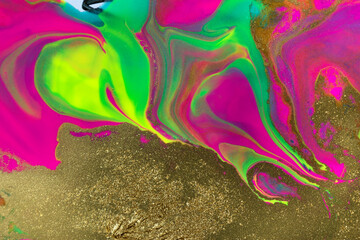 Gold glitter texture on fluorescent inks marble background.