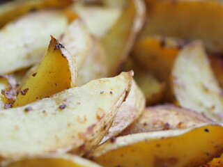 potato slices baked in butter with oregano turmeric and curry