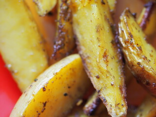 potato slices baked in butter with oregano turmeric and curry