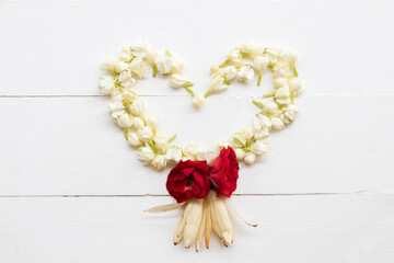 crown flower,red rose,white champaka,jasmine smell fragrance flora of asia thailand arrangement heart style on background white