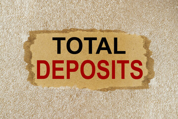 total deposits, chalkboard text on torn background