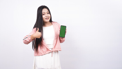 beautiful asian woman pointing green screen in handphone isolated white background