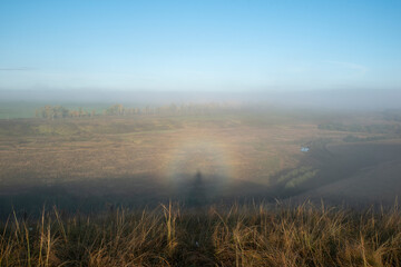 Rare optical phenomenon Gloria on a foggy morning. Rainbow