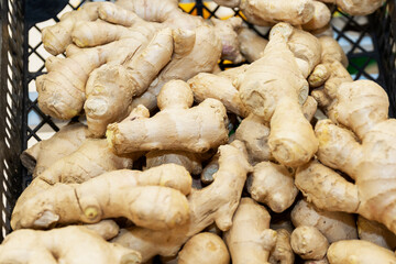 Ginger root in a basket on the counter in the store. Prevention of colds.