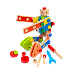 Colorful wooden robot toy with tools isolated on white background. Preschool education concept