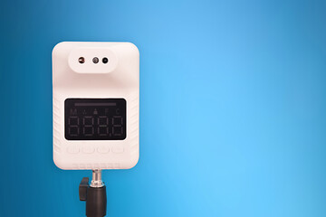 stand temperature scanner with blue background