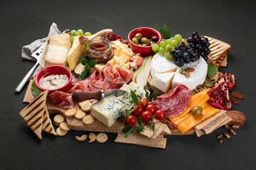 Appetizers table. Cheese, fuits and meat board