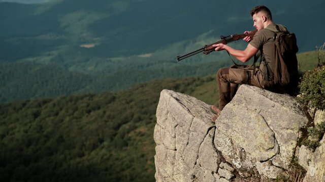 Hunting season. Hunter with gun. Animal Hunt. Man with shotgun.