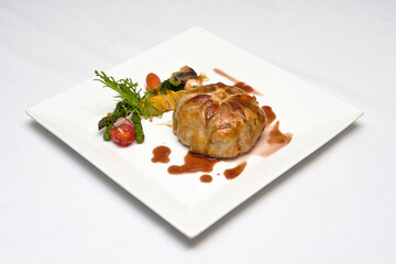 wellington steak in puff pastry with roasted vegetables, veal wellington