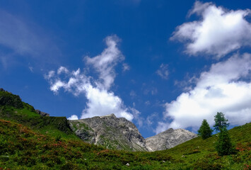 green mountains landscape with white clouds on the sky