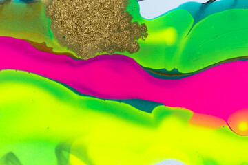 Gold glitter texture on fluorescent inks marble background.