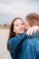 Fototapeta premium Young loving couple embracing each other outdoors in the park