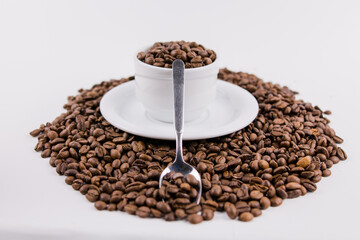 coffee cup with coffee beans on white background