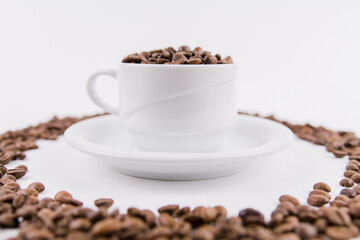 coffee cup with coffee beans on white background