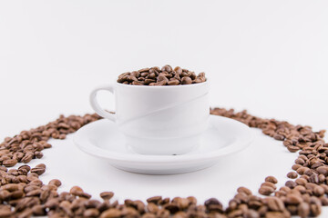 coffee cup with coffee beans on white background