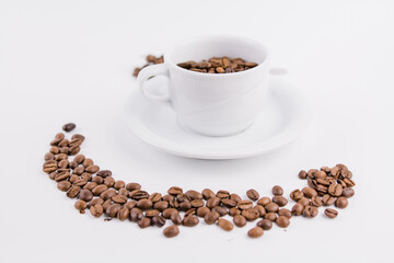 coffee cup with coffee beans on white background