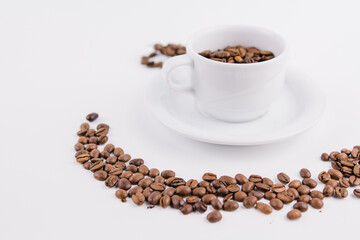 coffee cup with coffee beans on white background