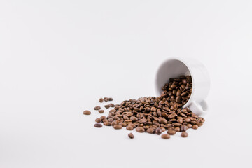 white cup of coffee with sprinkled coffee beans