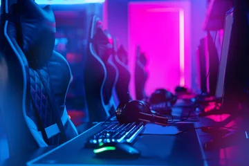 Fotobehang Gaming Workplace Professional gamers cafe room with powerful personal computer game chair blue color. Concept cyber sport arena  © Parilov