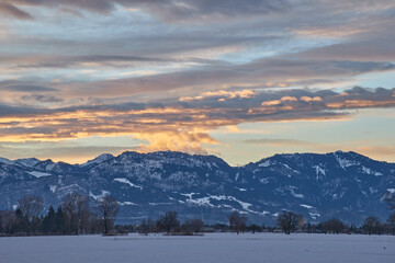 Sunrise over snowy mountain landscape