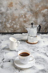 Geyser coffee maker, cup and pot with milk