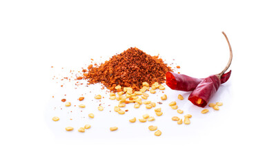 pile crushed red cayenne pepper, dried chili flakes and seeds on white background.