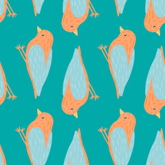 Animal flying seamless pattern with orange colored bird silhouettes. Blue bright background.
