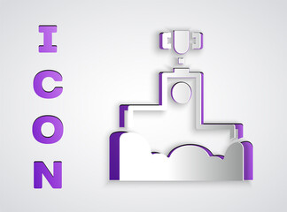 Paper cut Award over sports winner podium icon isolated on grey background. Paper art style. Vector.