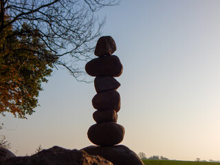person sitting on a stone