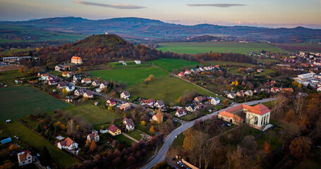 aerial view of city with little church on hill