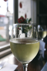 glass of white wine on the table