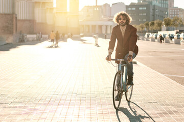 Man enjoying a bicycle ride on city street.