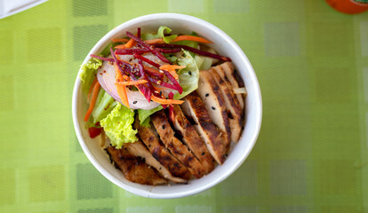 Grilled chicken with vegetables noodle meal in a box